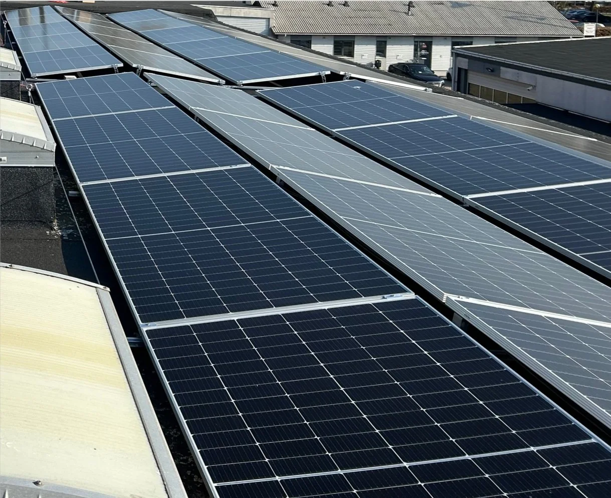 Solar panels installed on an industrial roof